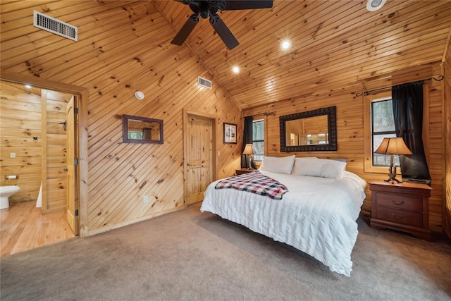 bedroom featuring wood ceiling, high vaulted ceiling, wood walls, and carpet