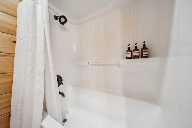 bathroom with shower / bathtub combination with curtain