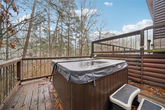 wooden terrace featuring a hot tub