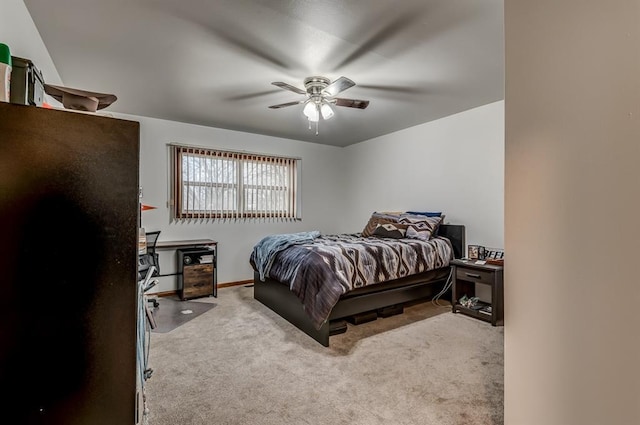 bedroom with light carpet, beverage cooler, and ceiling fan