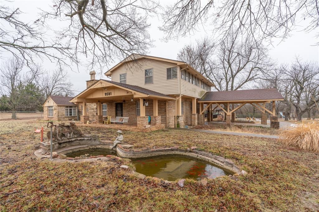 back of property with a gazebo