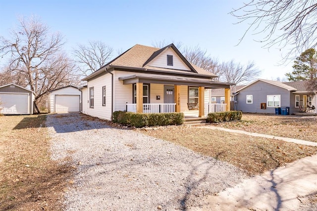 view of front of home with an outbuilding, a garage, and a porch