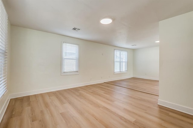 spare room featuring light hardwood / wood-style flooring