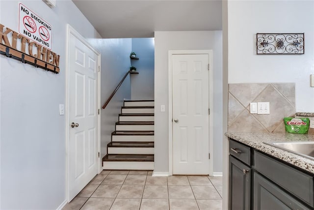 staircase with tile patterned flooring