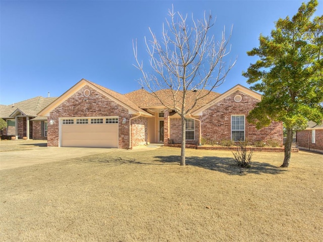 ranch-style house with a garage, concrete driveway, and brick siding