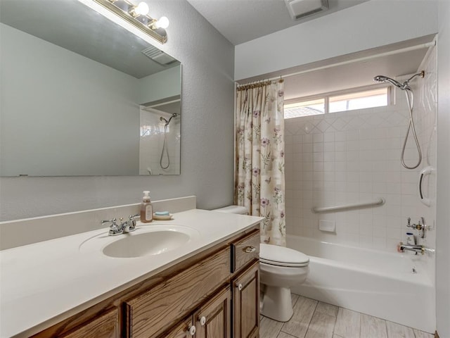 full bathroom with a textured wall, toilet, wood tiled floor, shower / bath combination with curtain, and vanity