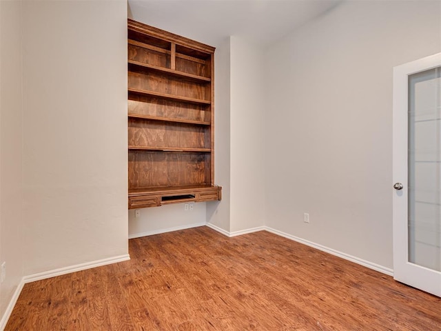 unfurnished bedroom featuring hardwood / wood-style floors