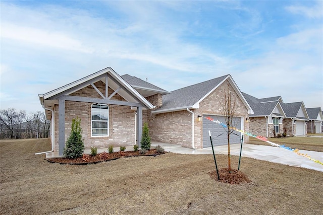 view of front of house with a garage and a front yard