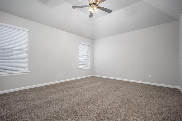 spare room featuring ceiling fan, lofted ceiling, and carpet flooring