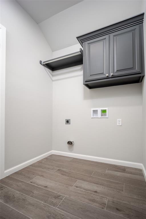 laundry room featuring dark hardwood / wood-style floors, hookup for a washing machine, and electric dryer hookup