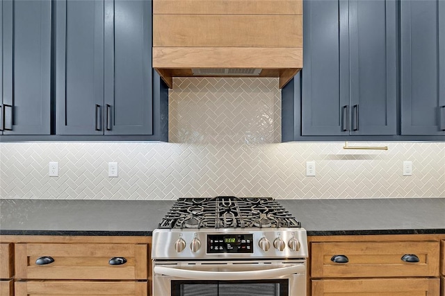 kitchen featuring extractor fan, backsplash, and stainless steel gas range