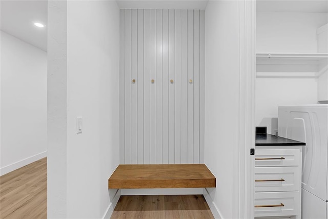 mudroom with washer / clothes dryer and light hardwood / wood-style flooring