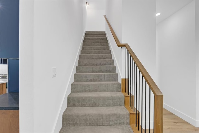 stairs with wood-type flooring