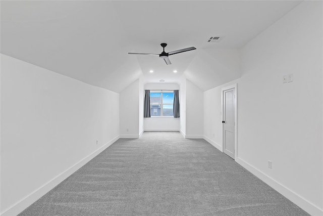 additional living space featuring lofted ceiling, carpet, and ceiling fan