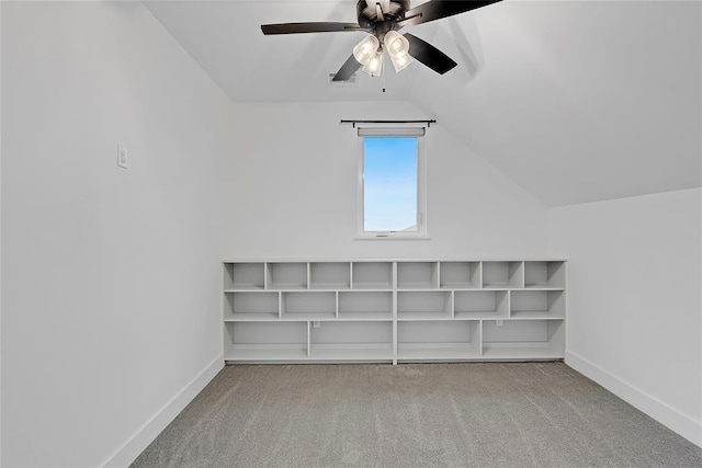 additional living space featuring lofted ceiling, light colored carpet, and ceiling fan