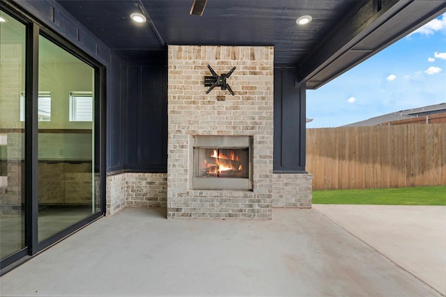 view of patio / terrace featuring an outdoor brick fireplace