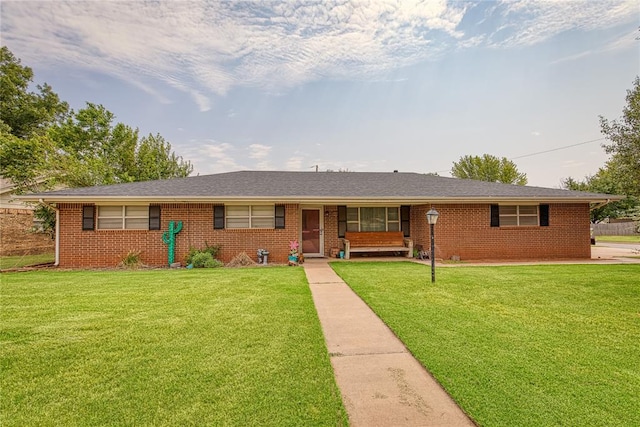 single story home with a front lawn