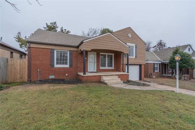 view of front of house with a garage and a front yard