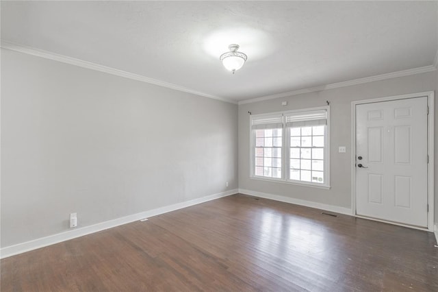 empty room with ornamental molding and dark hardwood / wood-style floors