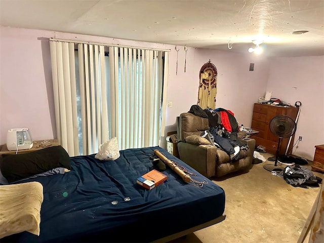 bedroom with concrete flooring