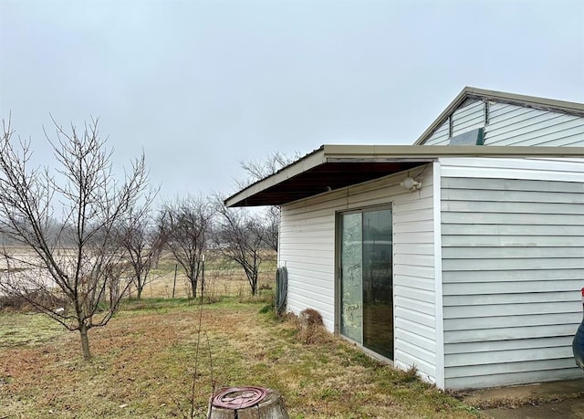 view of home's exterior with a lawn