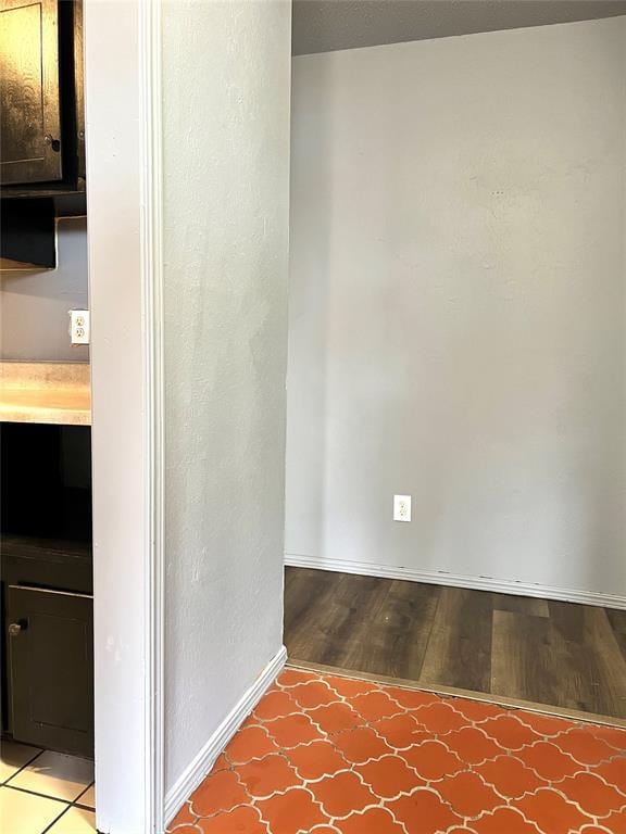 unfurnished room with wood-type flooring