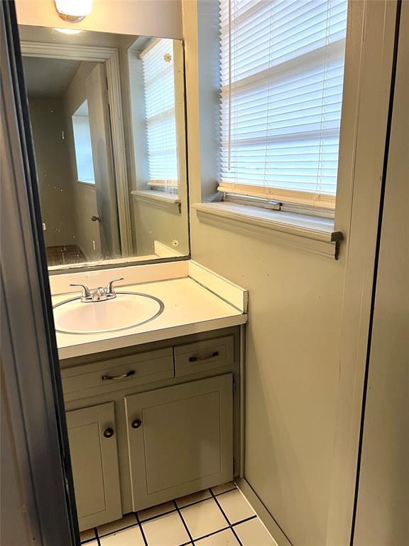 bathroom with vanity and tile patterned floors