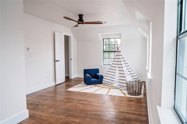 unfurnished room featuring ceiling fan, lofted ceiling, and dark hardwood / wood-style flooring