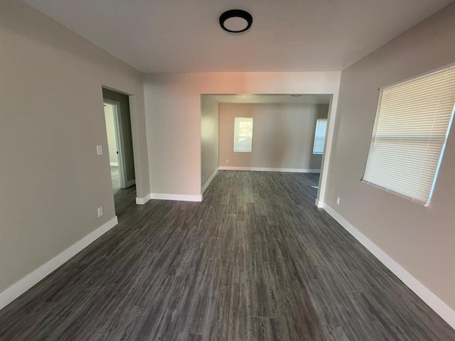 unfurnished room featuring dark hardwood / wood-style floors