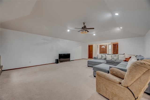 living room with lofted ceiling, light colored carpet, and ceiling fan