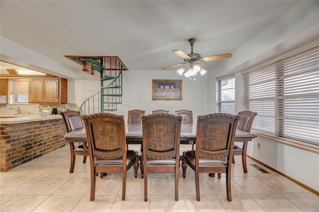 dining room with light tile patterned flooring and ceiling fan