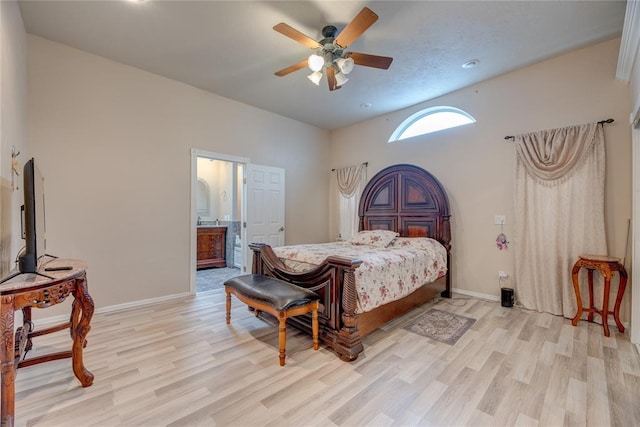 bedroom featuring ensuite bathroom, ceiling fan, and light hardwood / wood-style floors