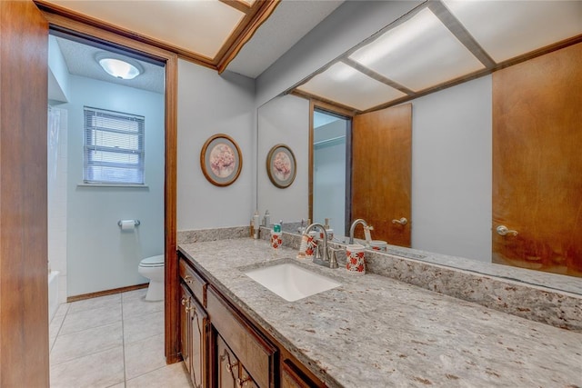 bathroom with vanity, toilet, and tile patterned flooring