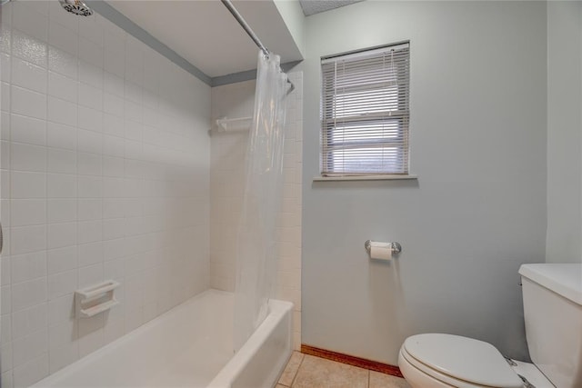 bathroom with tile patterned flooring, toilet, and shower / bath combo with shower curtain