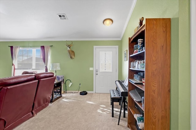 home office with baseboards, visible vents, crown molding, and carpet flooring