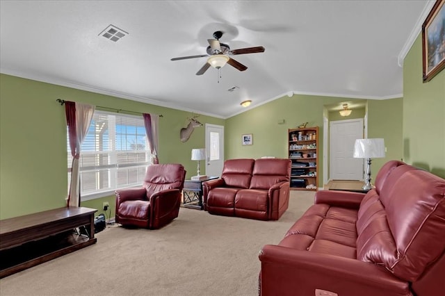 carpeted living area with lofted ceiling, ceiling fan, visible vents, and crown molding