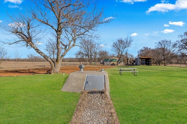 view of storm shelter featuring a lawn