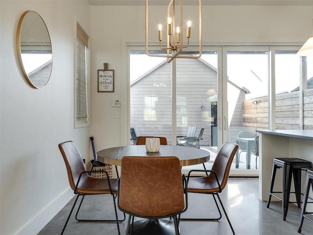 dining space featuring a chandelier