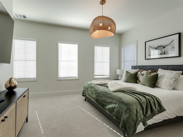 bedroom featuring light colored carpet