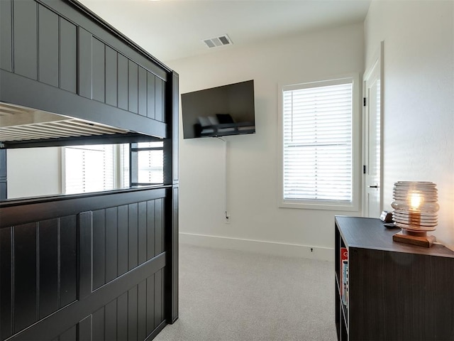 bedroom with light carpet