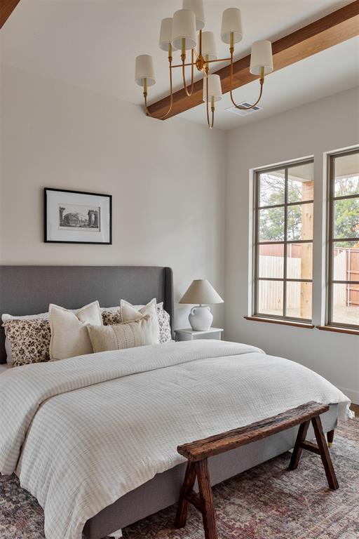 bedroom with a chandelier