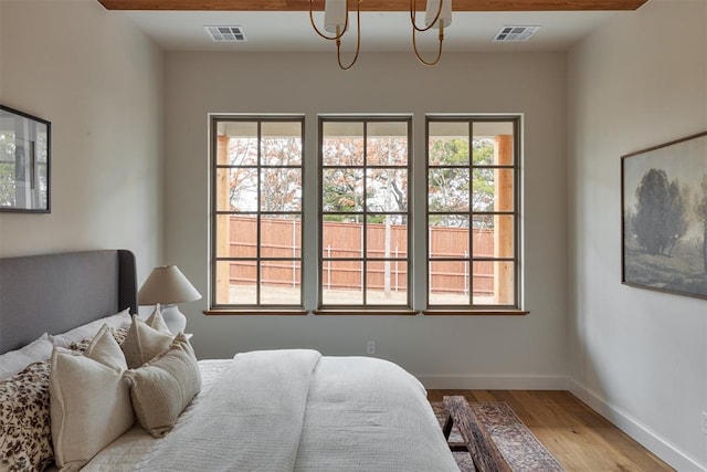 bedroom with wood-type flooring