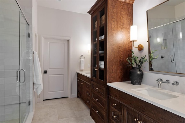 bathroom with vanity and an enclosed shower