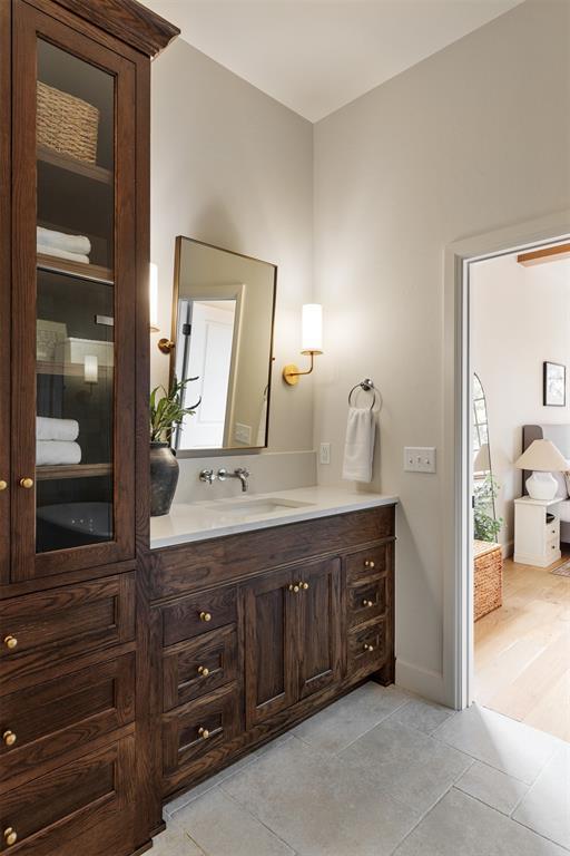 bathroom featuring vanity and tile patterned flooring