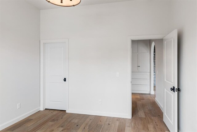 spare room with light hardwood / wood-style flooring