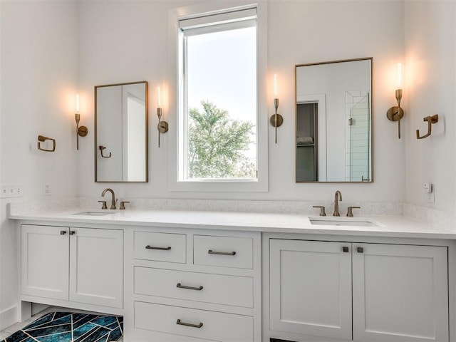 bathroom featuring double vanity and a sink