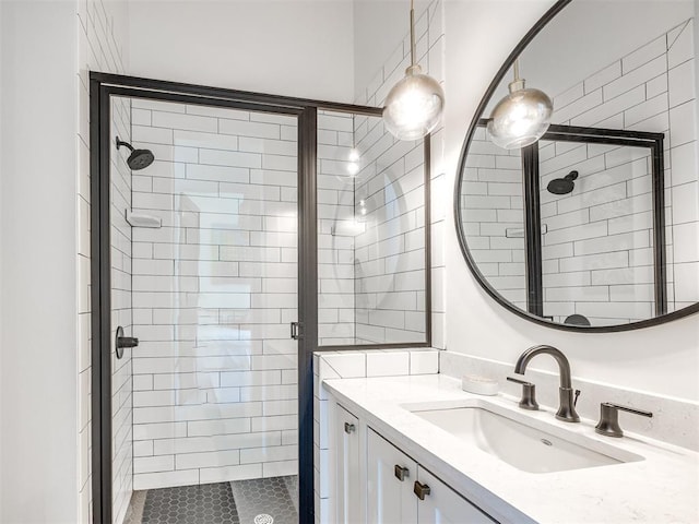 bathroom with a stall shower and vanity