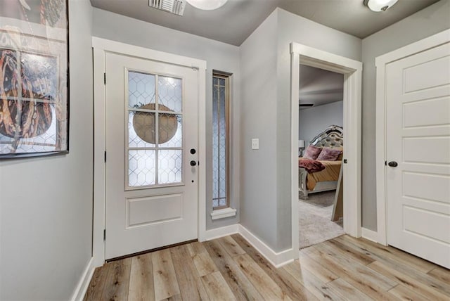 foyer with light wood-type flooring