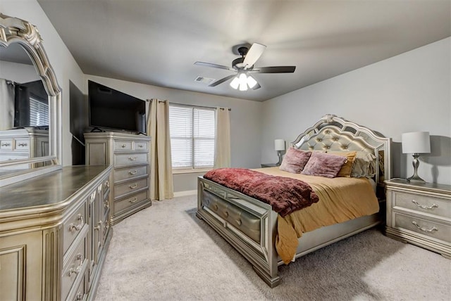 bedroom with light colored carpet and ceiling fan