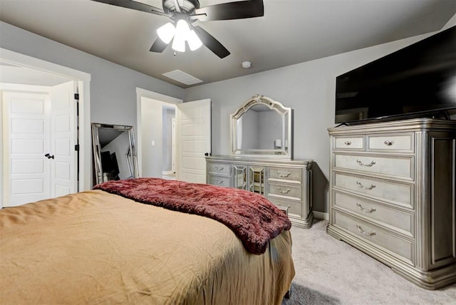 bedroom with light carpet and ceiling fan